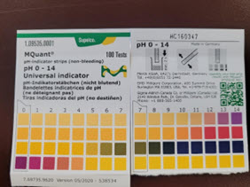 Picture show the pH scale from 0 to 14 with number and color references for the MQuant pH indicator strips.