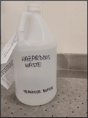 Photo of a properly manually labeled container of hazardous waste.